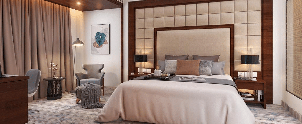 Suite with a king size bed and lamps on each side of the bed at BluSalzz Residence, Amritsar.